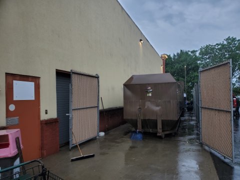 Dumpster enclosure area after pressure washing