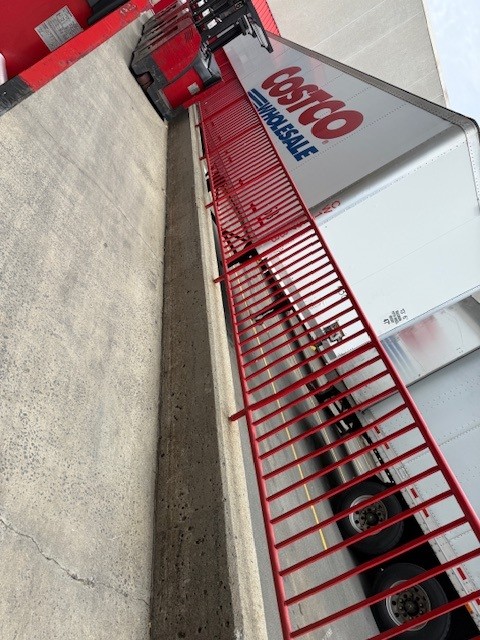 Costco trailer at loading dock with safety railing