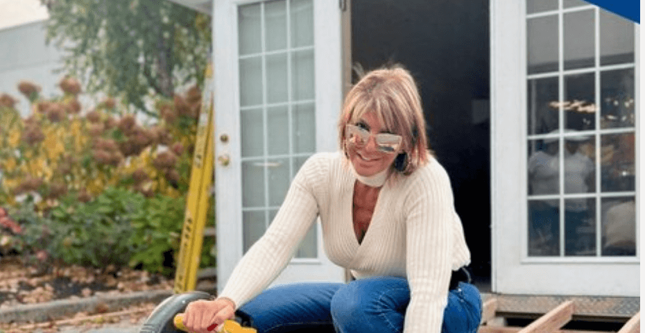 Owner, Marcie Manfredonia, preparing wood for a remodeling project