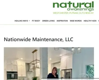 A woman stands and smiles in a modern white kitchen with gold accents, under a headline for Nationwide Maintenance, LLC, on the Natural Awakenings Westchester, Putnam, Dutchess NY website.